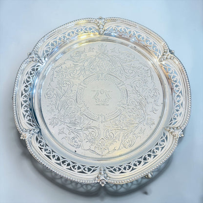 KLS Vaults Victorian sterling silver salver with intricate chased floral motifs, pierced gallery, and family crest.