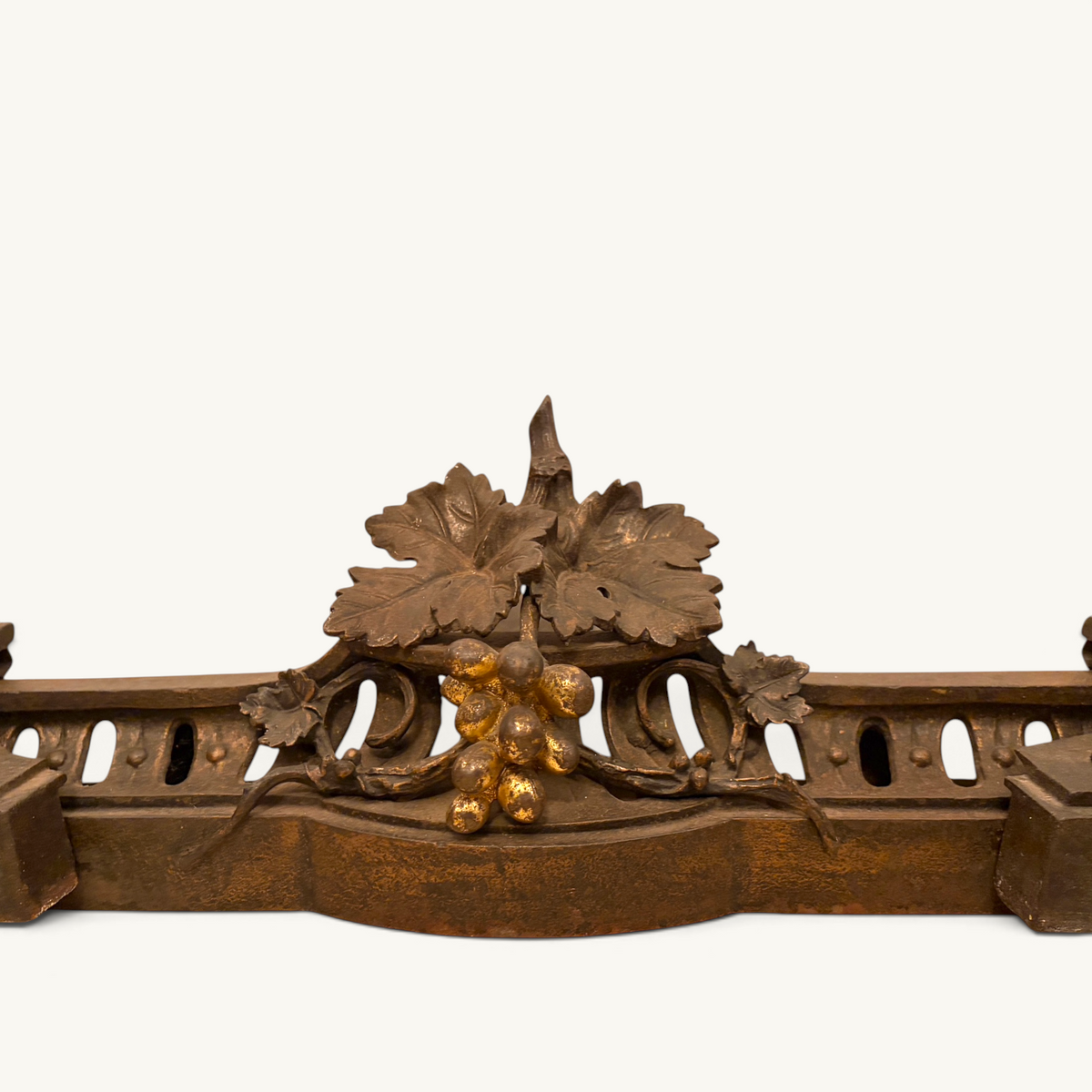 Victorian parcel-gilt bronze fireplace fender with naturalistic grapevine and snail motifs